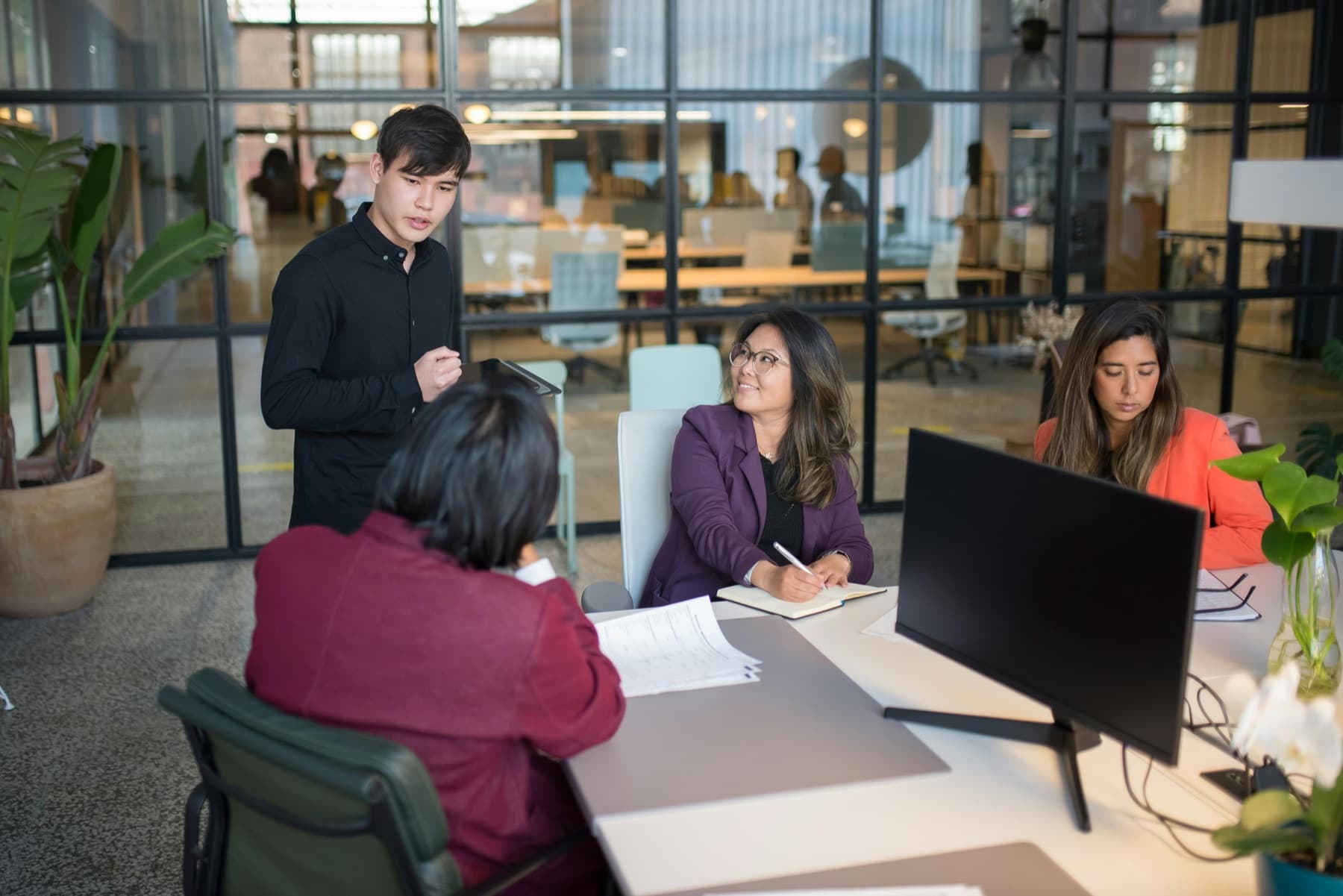 A small business team gathered around a screen, working through their readiness picture together